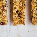 Granola bars on wooden background